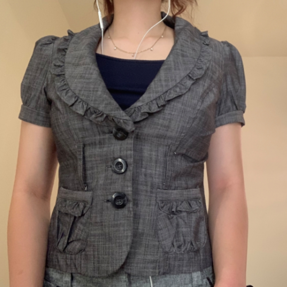 MY Michelle, grey blouse, with ruffles on the collar.